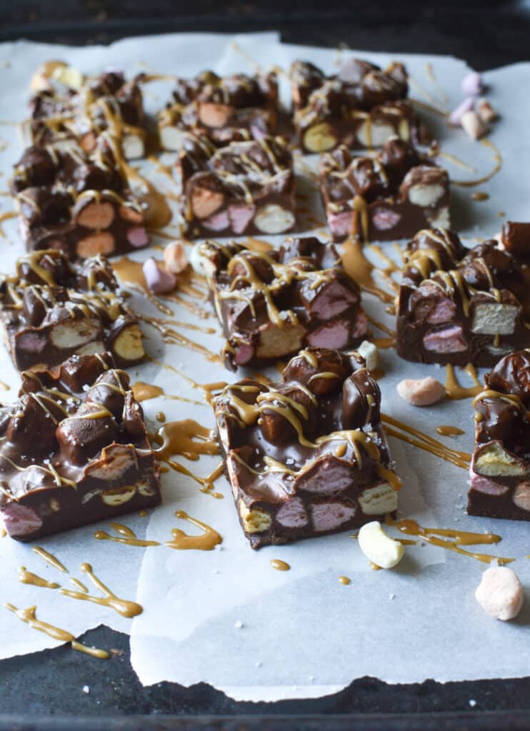 Chocolate Peanut Butter Marshmallow bars drizzled with melted peanut butter.