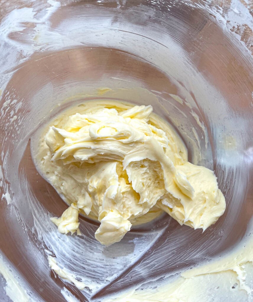 Butter that has been beaten until fluffy in the bowl of an electric stand mixer.