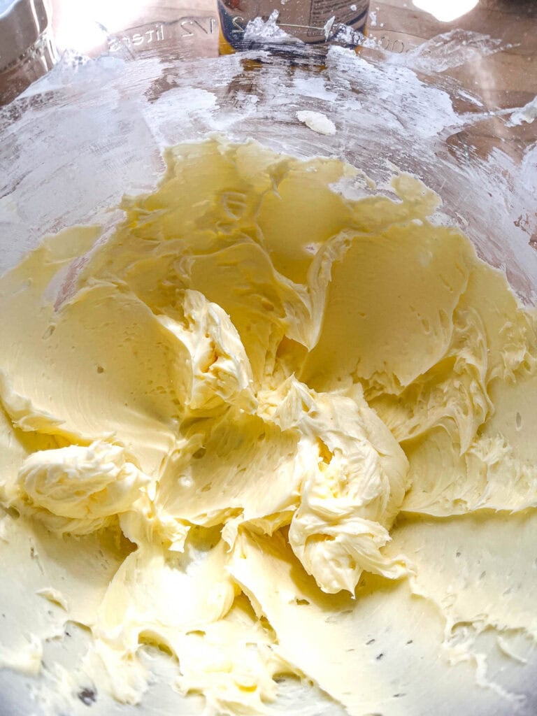 Butter, icing sugar and cornstarch mixed together in the the bowl of electric stand mixer.