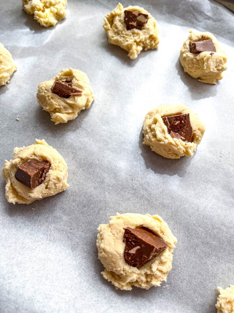 Toblerone shortbread cookies fresh from the oven on a cookie sheet.