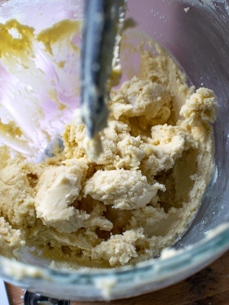 Lemon zest mixed into shortbread dough to make lemon snowball cookies.