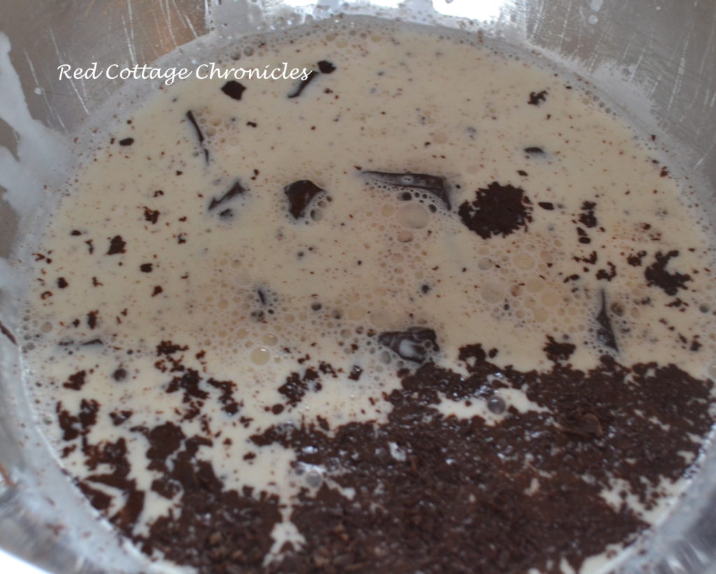 Pour simmering cream over chopped chocolate and allow to sit for a few minutes to allow chocolate to melt. Stir until smooth. Stir in the sour cream and vanilla