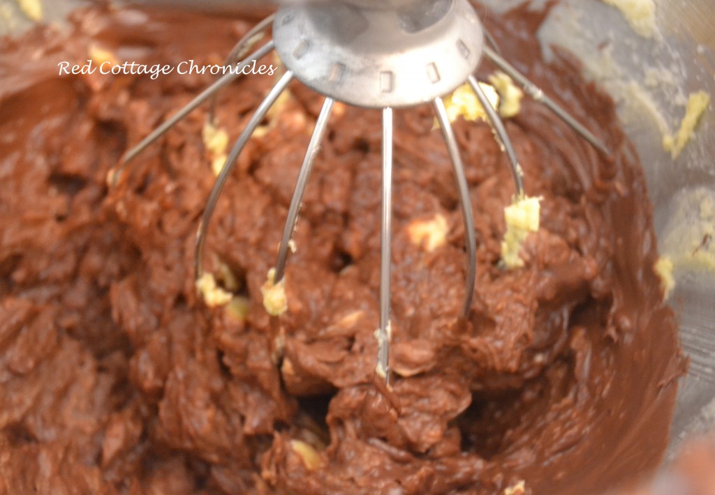 Beat in the melted chocolate mixture until smooth.