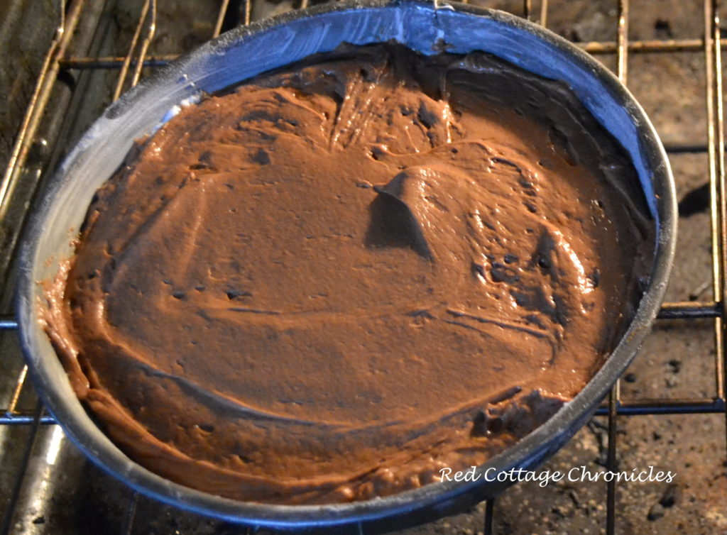 Divide batter between 2 round butterd and floured cake pans, smoothing down with a spatula