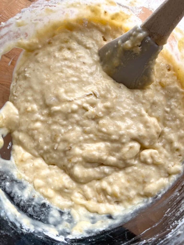 Batter for banana Nutella muffins in a large mixing bowl.