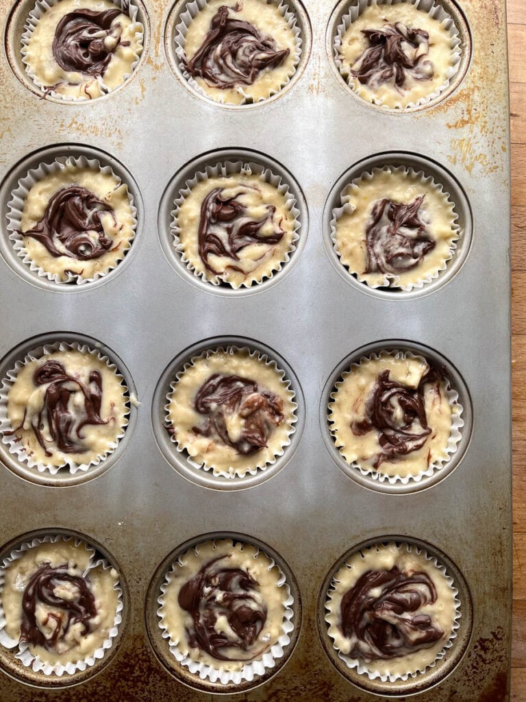 A spoonful of Nutella hazelnut spread swirled into the banana muffin batter before baking.