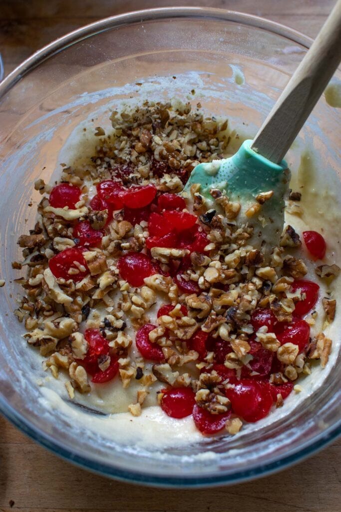 Chopped walnuts and halved maraschino cherries added to the bread batter.