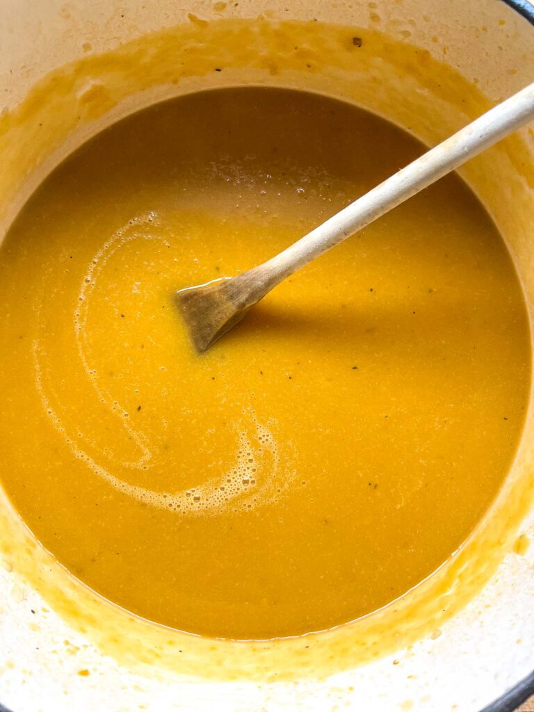 Maple roasted butternut squash soup that has been pureed until creamy with an immersion blender.