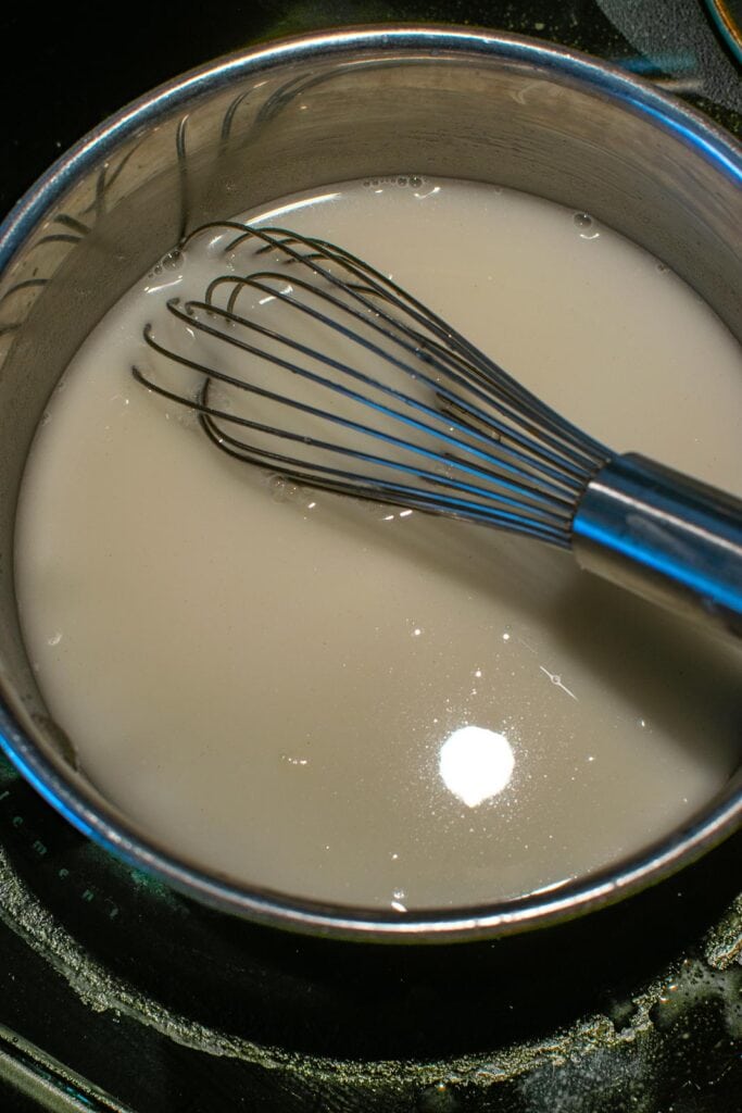 Water added to sugar, cornstarch mixture to make lemon pie filling.
