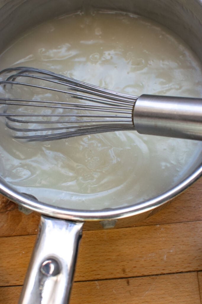Lemon and cornstarch cooked with water until thickened and bubbly in a saucepan on the stove top.