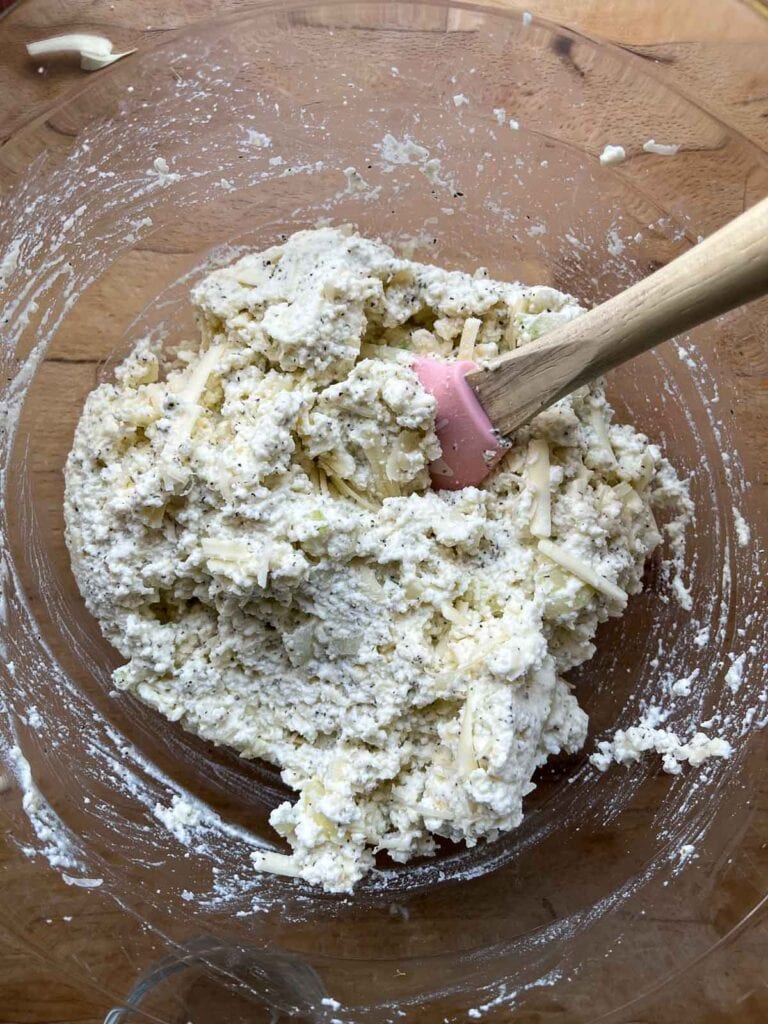 Cheese mixture including ricotta, parmesan and mozzarella mixed with spices to fill manicotti shells.