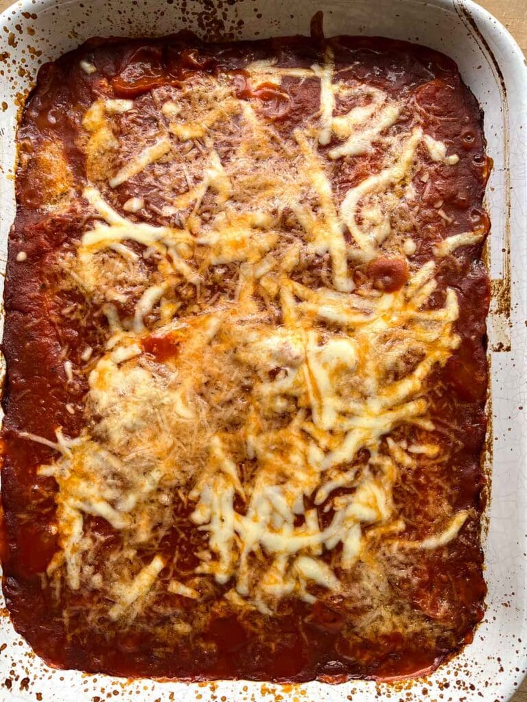 Baked cheese manicotti topped with fresh melted cheese fresh our of the oven.