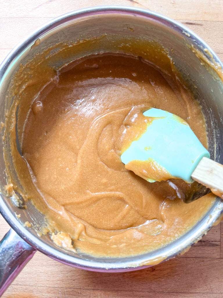 Peanut butter, brown sugar and corn syrup heated until melted I a large saucepan.