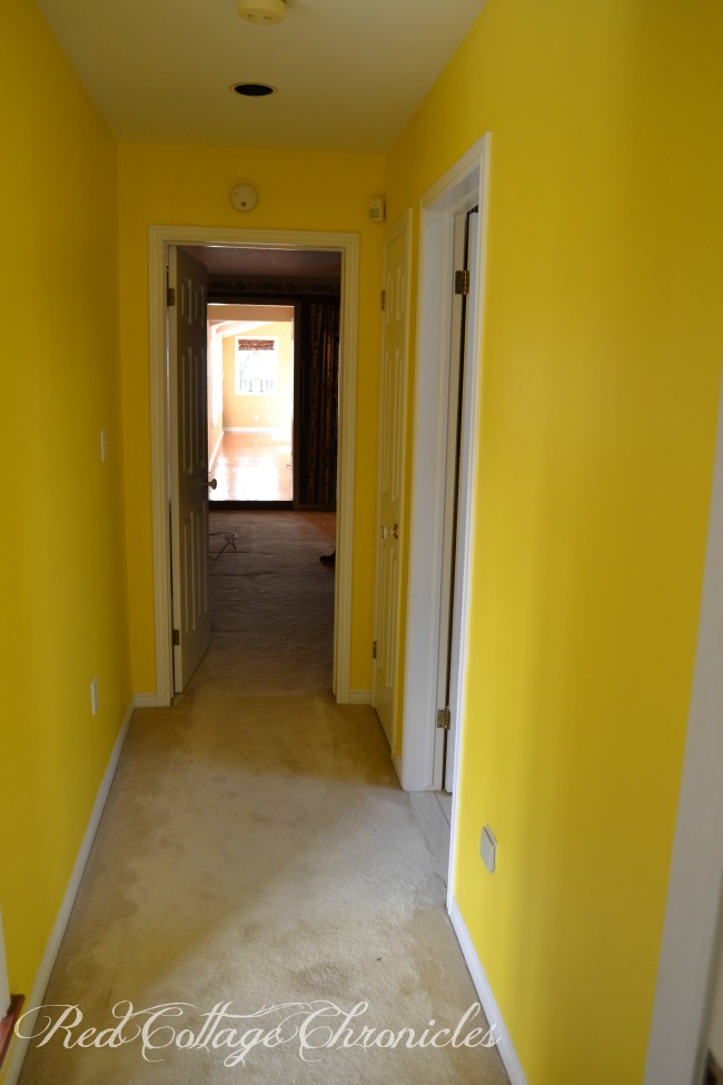 A fresh coat of paint tones down a previously bright yellow hallway