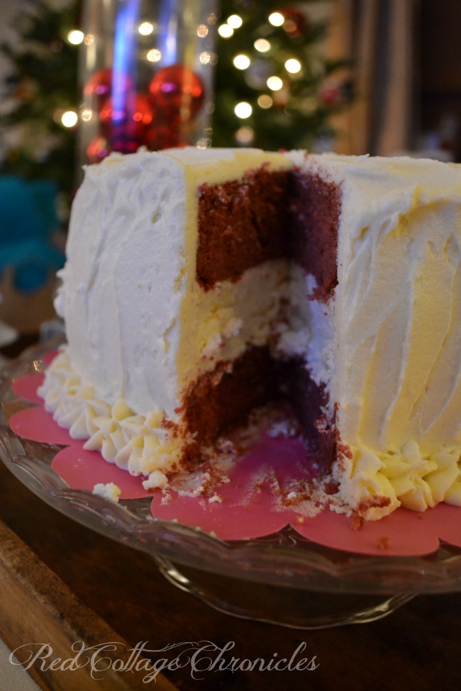 A decadent cheesecake layered between moist red velvet cake, all smothered in a buttercream frosting