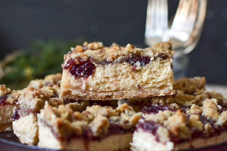 A close up of a cranberry cheesecake bar at eye level.