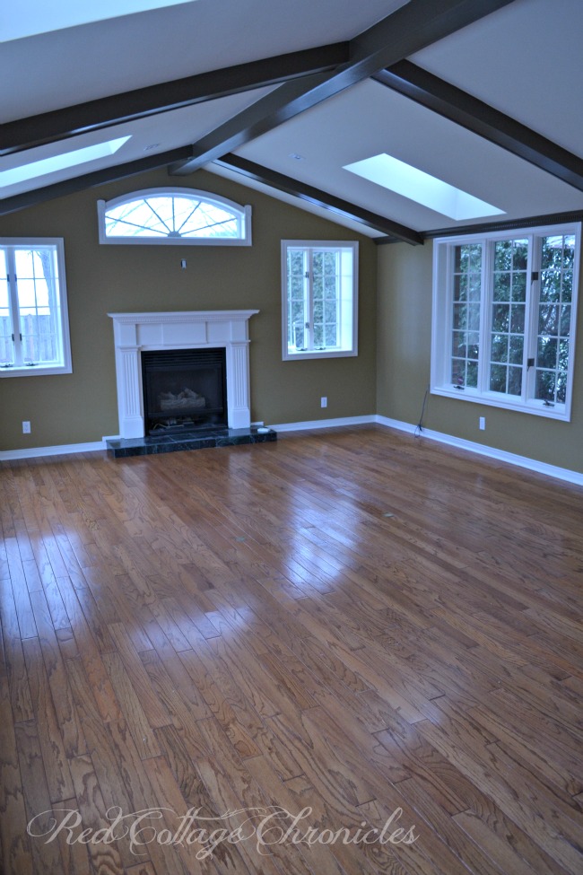 Lots of windows and skylights makes for a beautiful family room with a view of the landscaped backyard