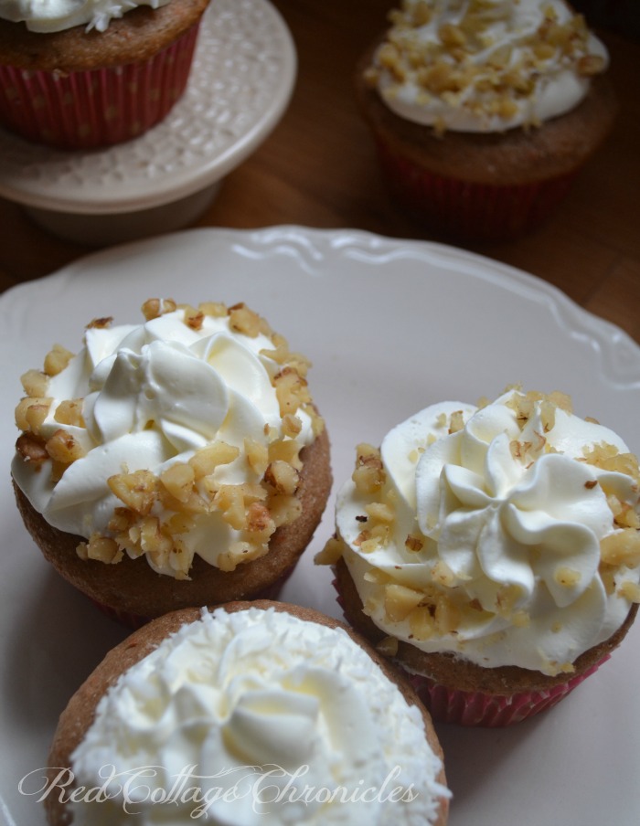 A creamy cream cheese whipped cream frosting tops these easy carrot cake muffins