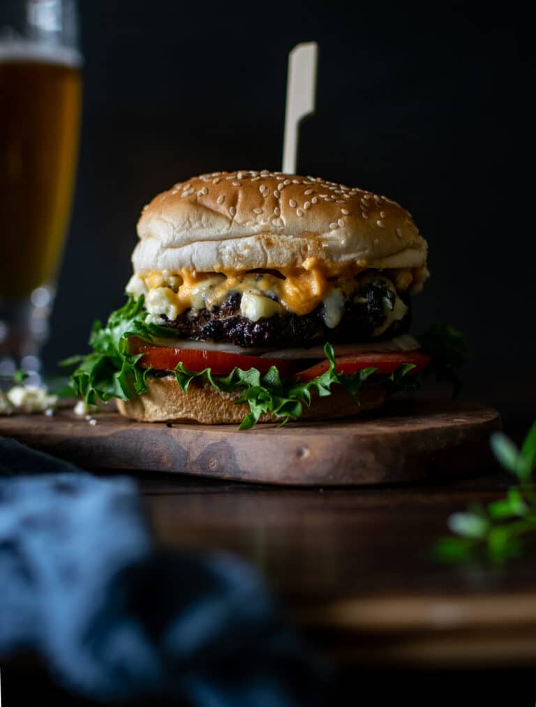 Buffalo Wing Burger and a glass of beer.