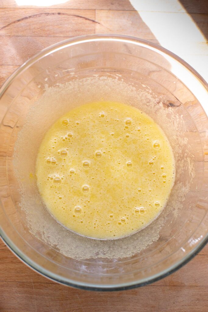 Eggs and vanilla extracted added to the sugar oil mixture and whisked until smooth.
