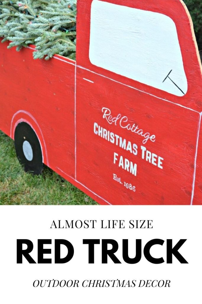 Almost life size red truck made from plywood. Perfect for outdoor Christmas decorating.