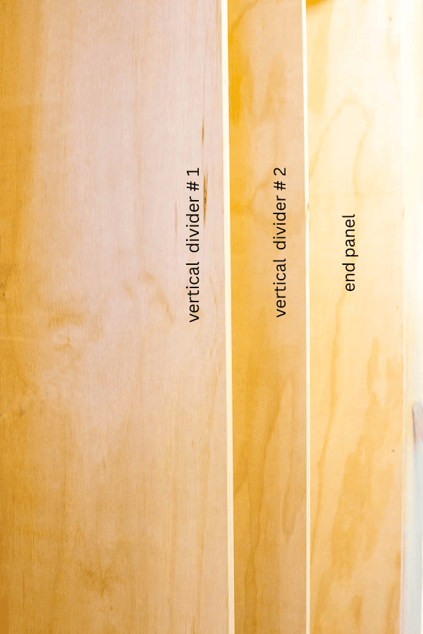 2 plywood vertical dividers inside a frame for a new pantry.