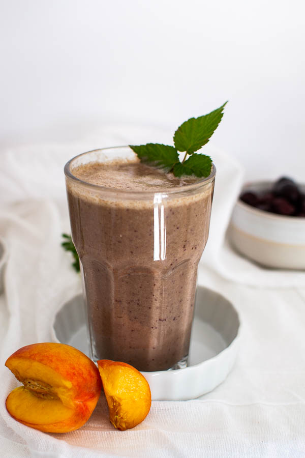 Fresh fruit smoothie with peaches, cherries and hemp powder