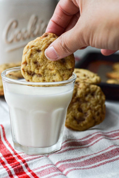 Dunking a cookie into a glass of milk