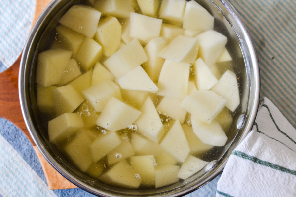A pot of potatoes ready to par boil