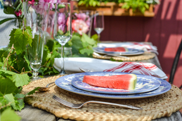 summer celebration tables cape with blue and white dishes and watermelon