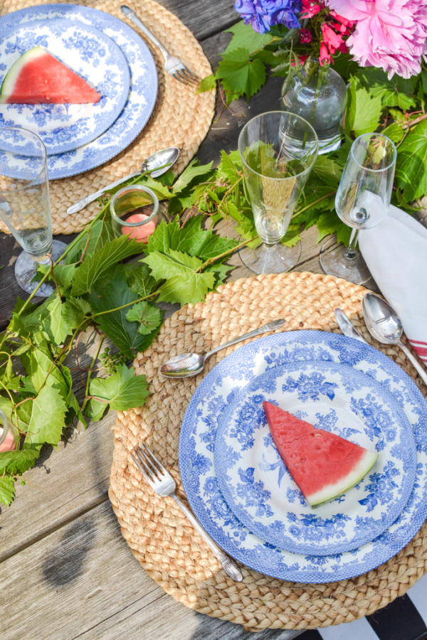 Watermelon top blue and white dinner plates for an outdoor dinner party