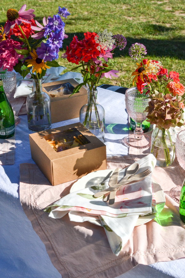 Boxed picnic lunch and flowers