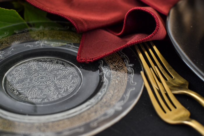 Gold embellished crystal plate on an elegant Halloween tablescape