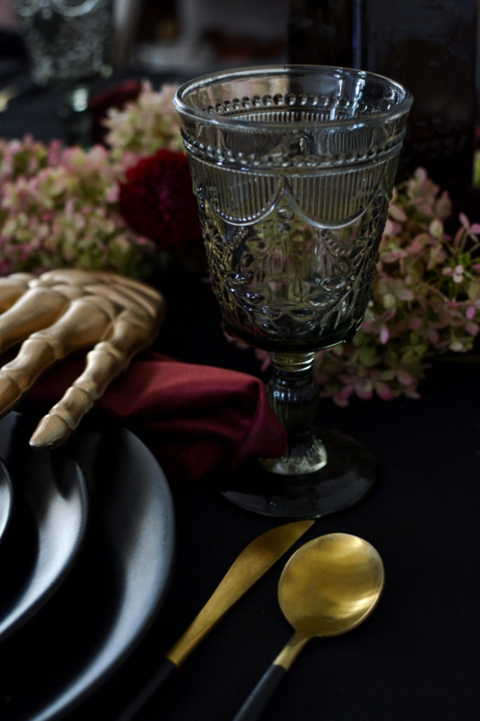 Smoke pressed glass water goblets on a Halloween table