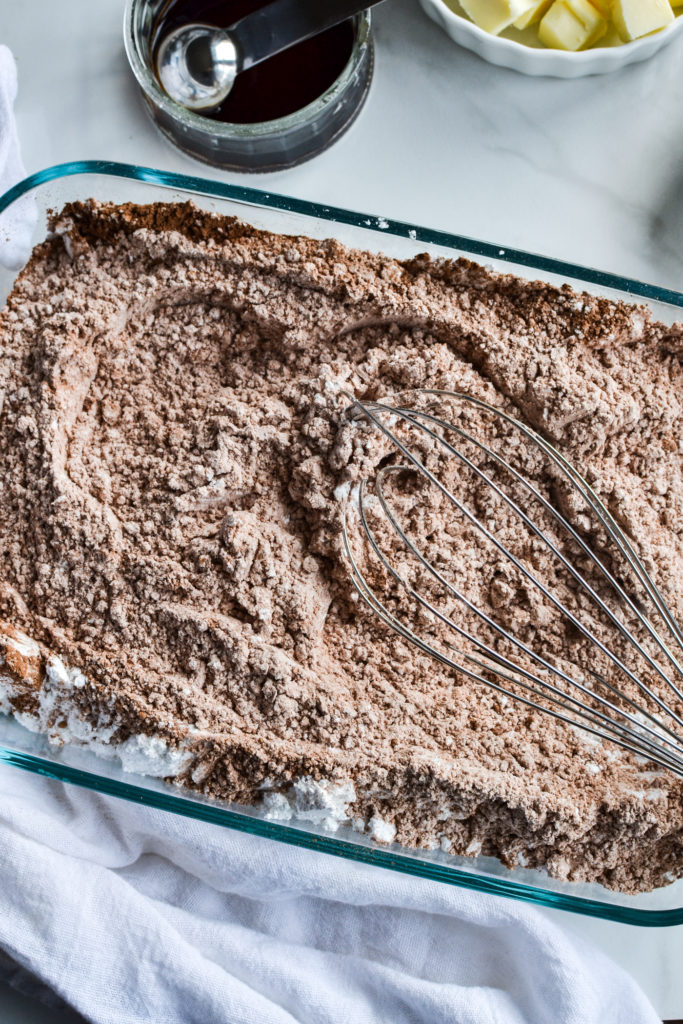 whisking cocoa powder and confectioners sugar for fudge recipe