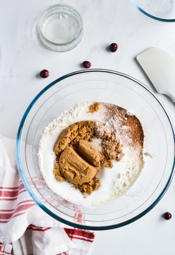 Mixing dry ingredients for cranberry orange bread