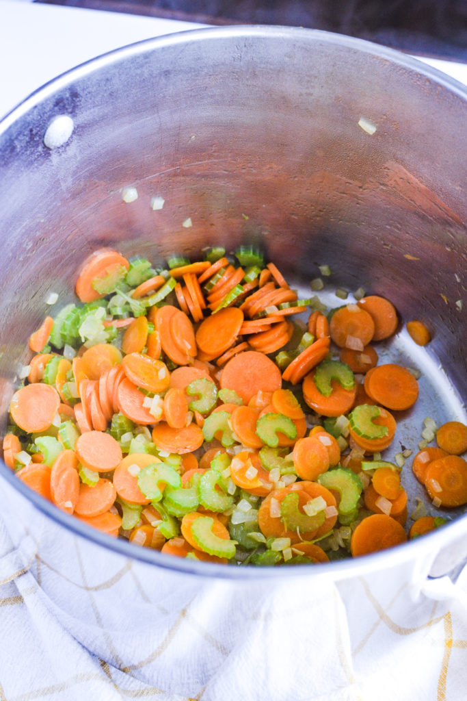 Carrots, celery and onion in a soup pot