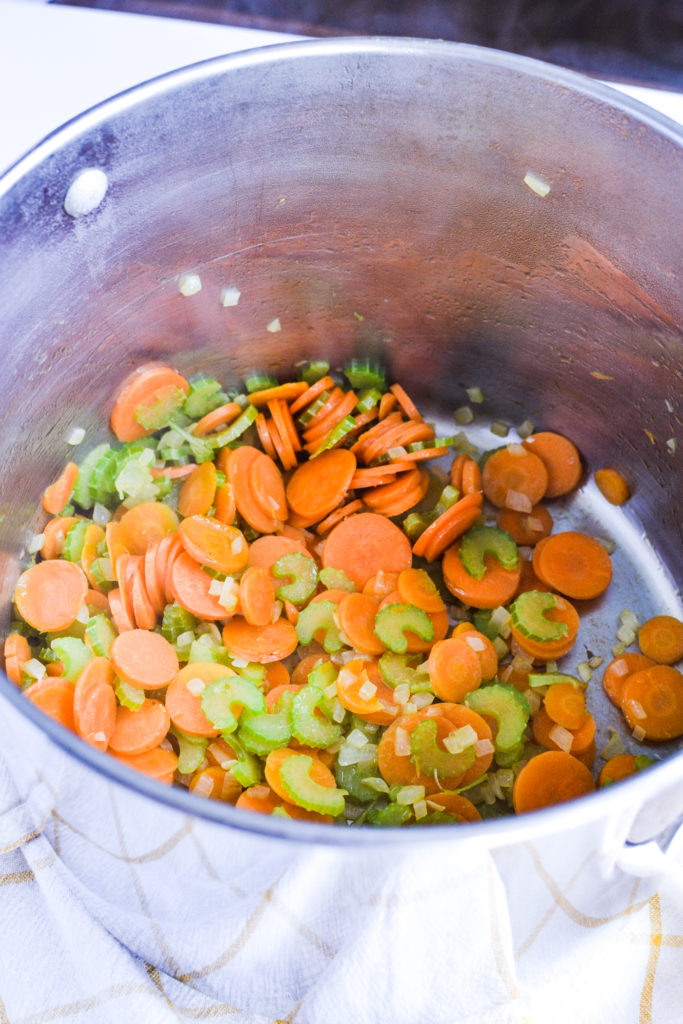 Carrots, celery and onion in a soup pot