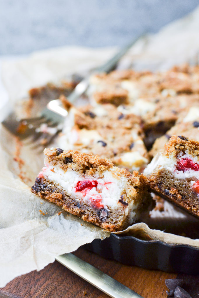 Chocolate Chip Cheesecake bars stacked in the pan