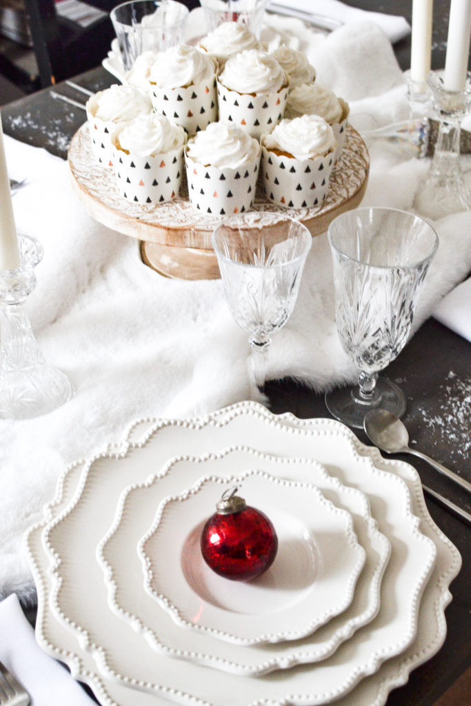 A dining table decorated all in white for Christmas