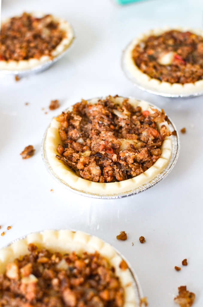 tart shells fill with plant-based tourtiére filling