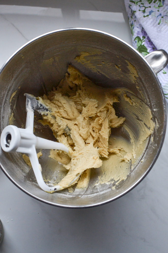 flour added to the butter sugar mixture for cupcakes