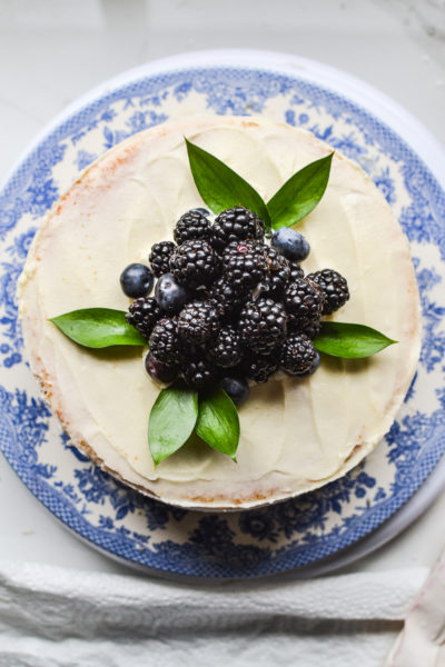 Top view of a cake decorated with fresh blueberries and blackberries