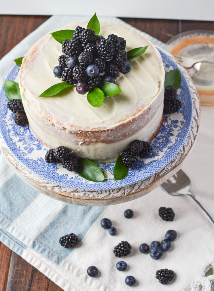 Easy Berry Semi Naked Cake decorated with blackberries and blueberries