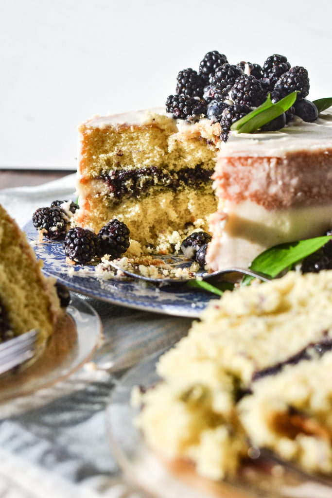 Slice of blueberry filled layer cake