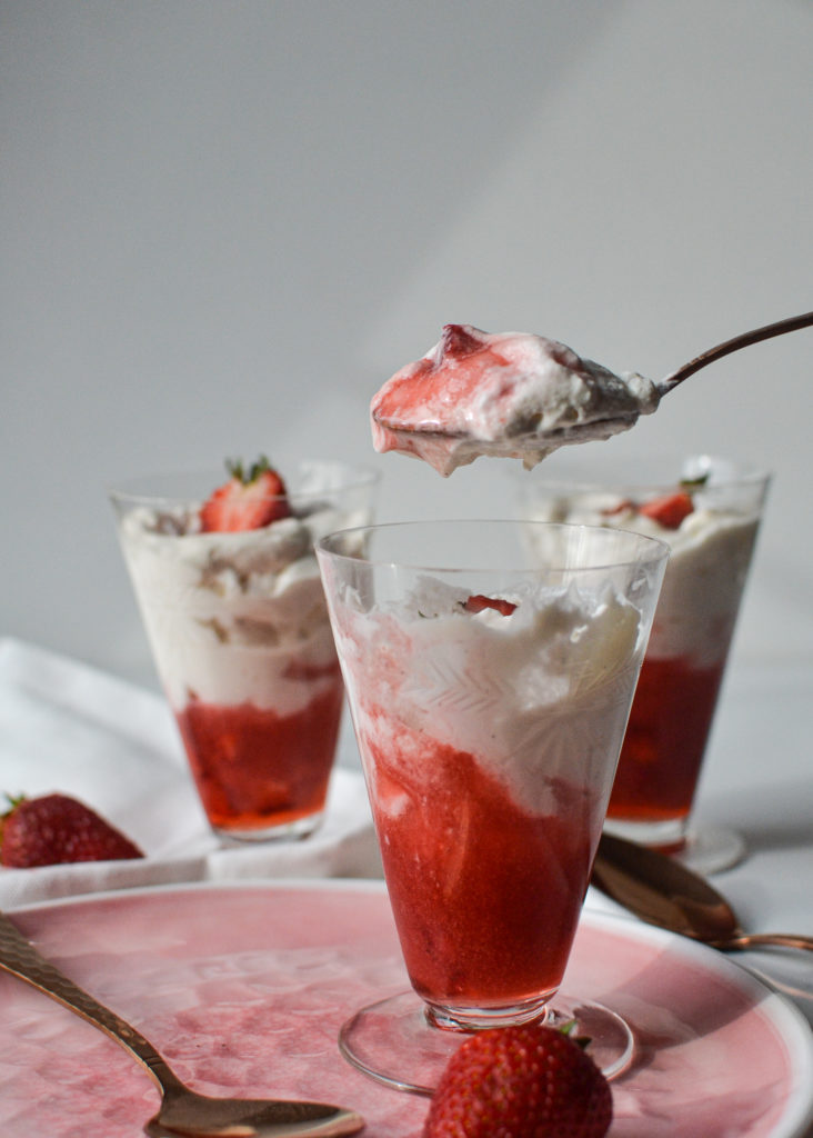 A spoonful of a creamy strawberry dessert