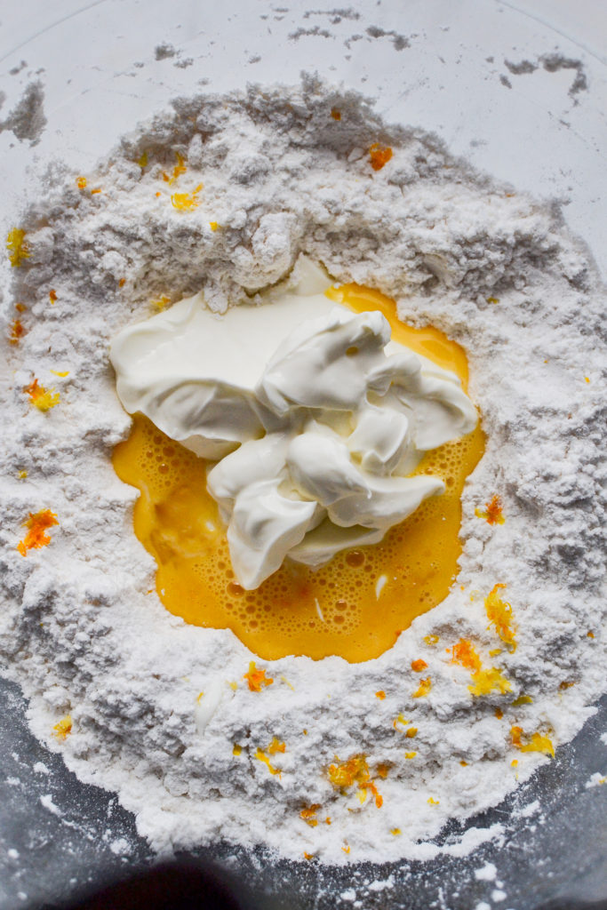 Adding the wet ingredients to the drop biscuit dough