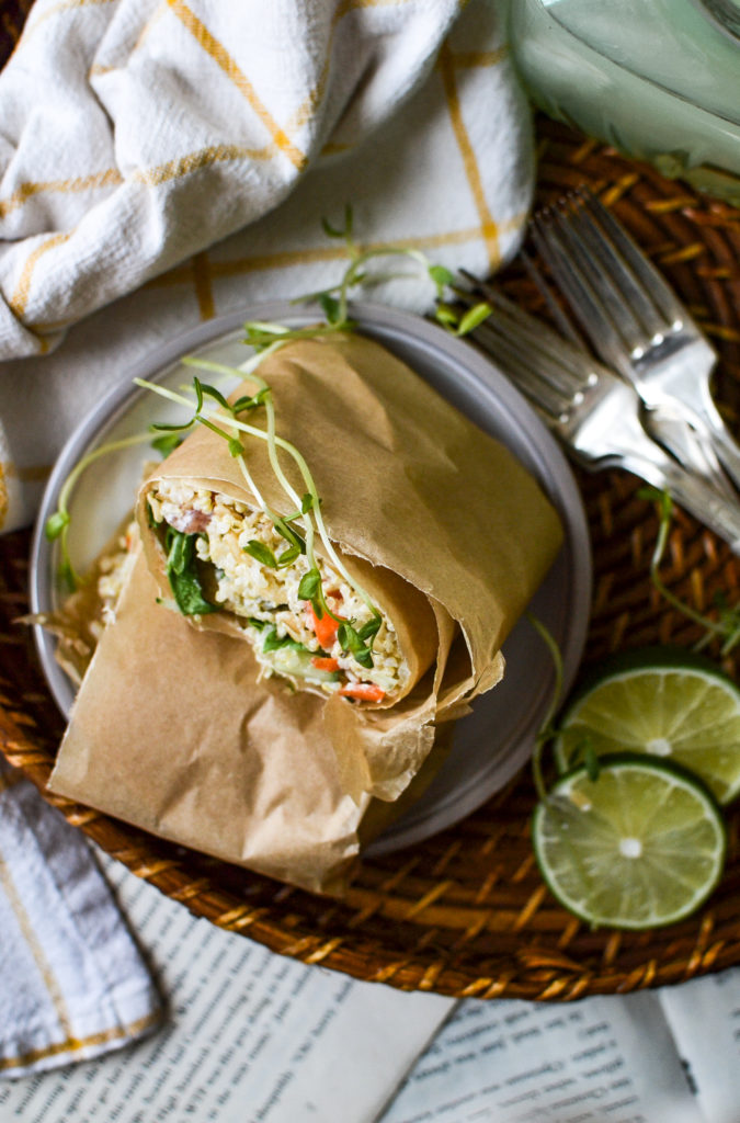 Tortilla wrap stuffed with brown rice, quinoa and chopped veggies