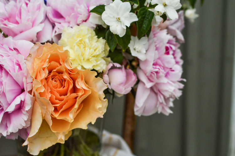 Hand Tied Bouquet made with peonies, roses and carnations