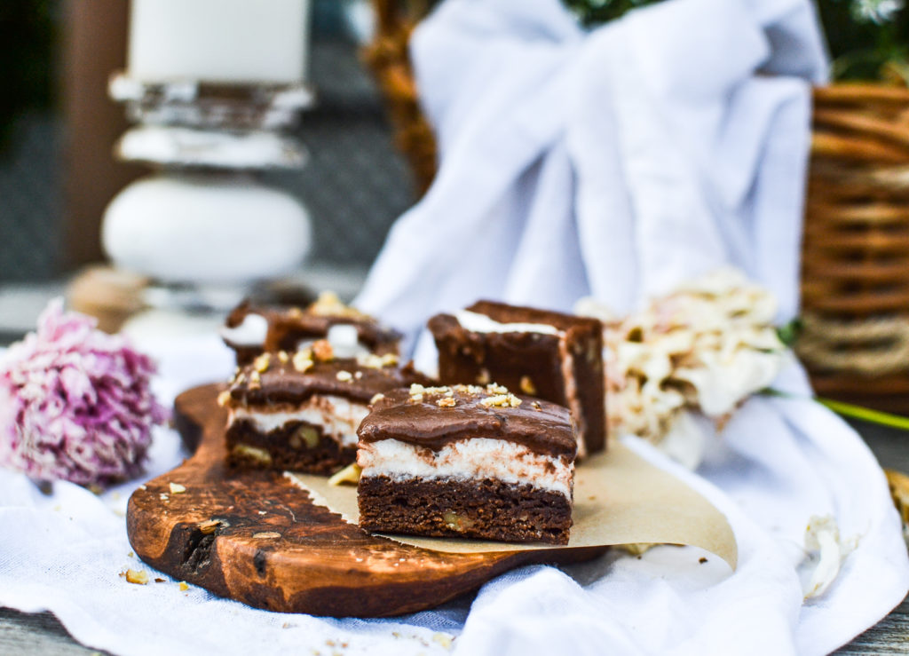 a platter of chocolate frosted marshmallow brownies